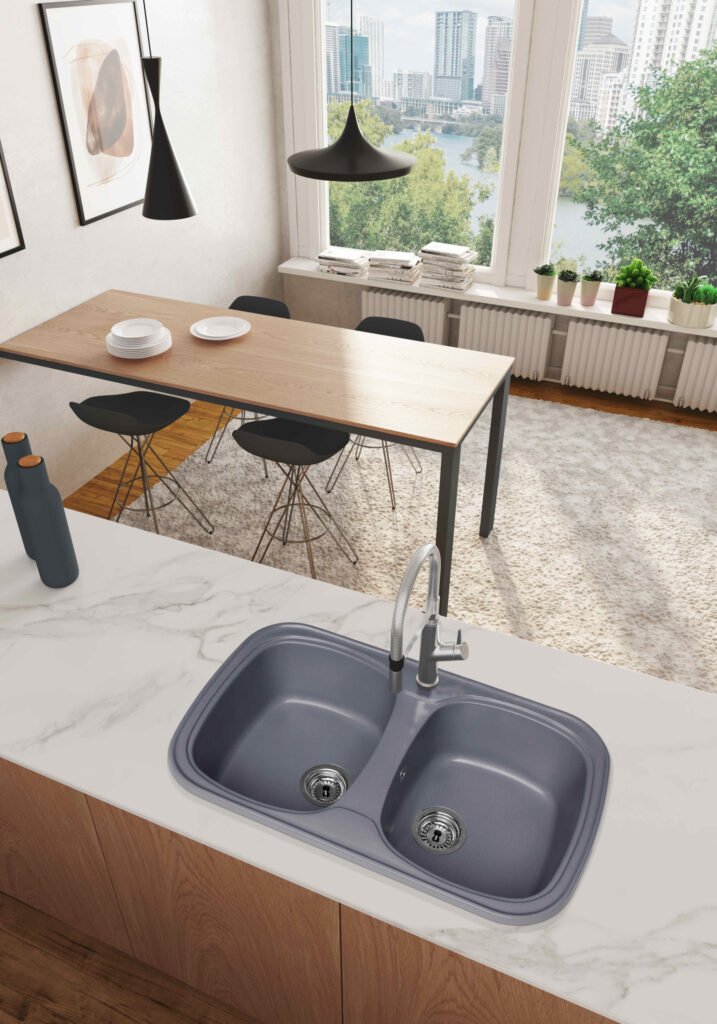 Fregadero Fedra de dos senos cuadrados instalado sobre encimera; grifería, encimera, mueble y decoración no incluidos.
