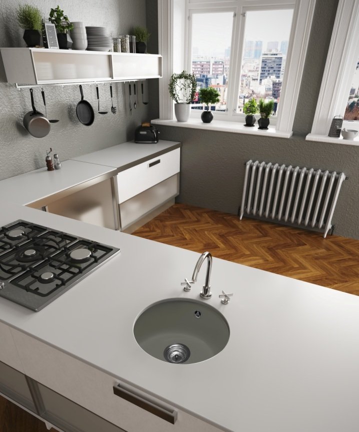 Fregadero Minos circular de una cubeta instalado bajo encimera; grifería, encimera, mueble y decoración no incluidos.