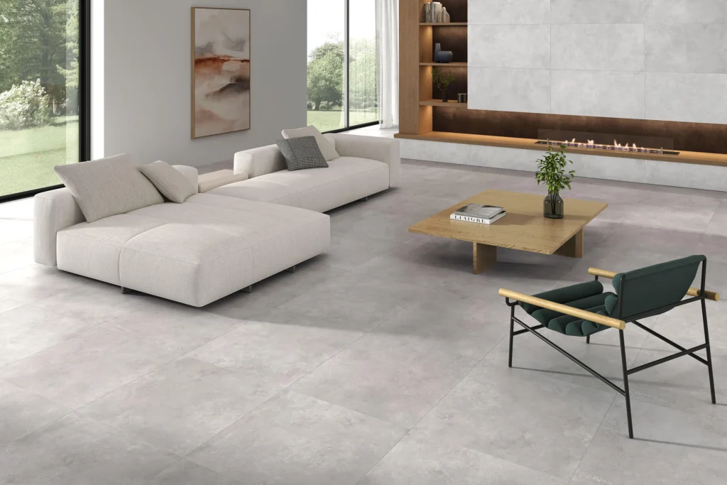 Suelo porcelánico Dayson Grey 75 × 75 cm · ambiente de salón